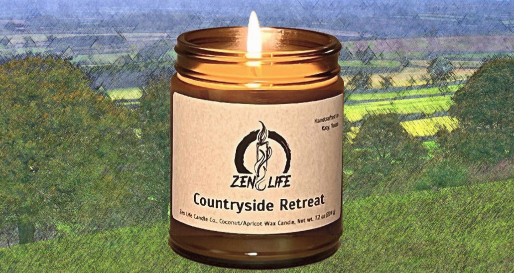 The Countryside Retreat Candle over an oil pastel countryside.