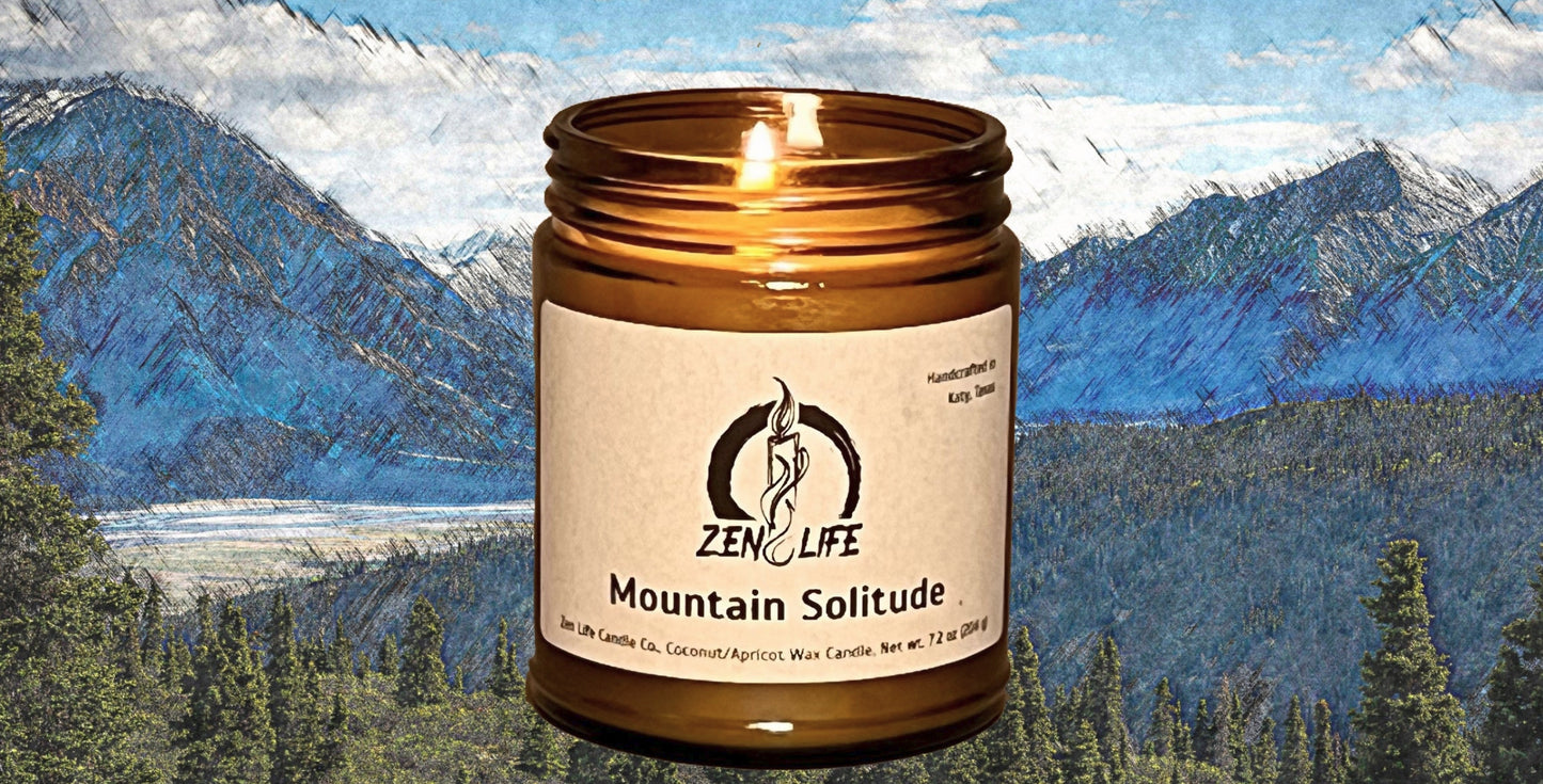 A lit candle labeled 'Mountain Solitude' highlighting a calming mountain fragrance with notes of ozone, moss, and cedar.