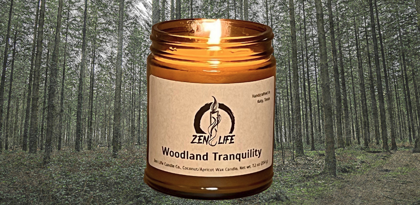 The Woodland Tranquility candle over an oil pastel forest.