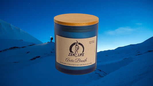 Zen Life's Arctic Breath candle with a background showing ahiker in the snowy arctic.