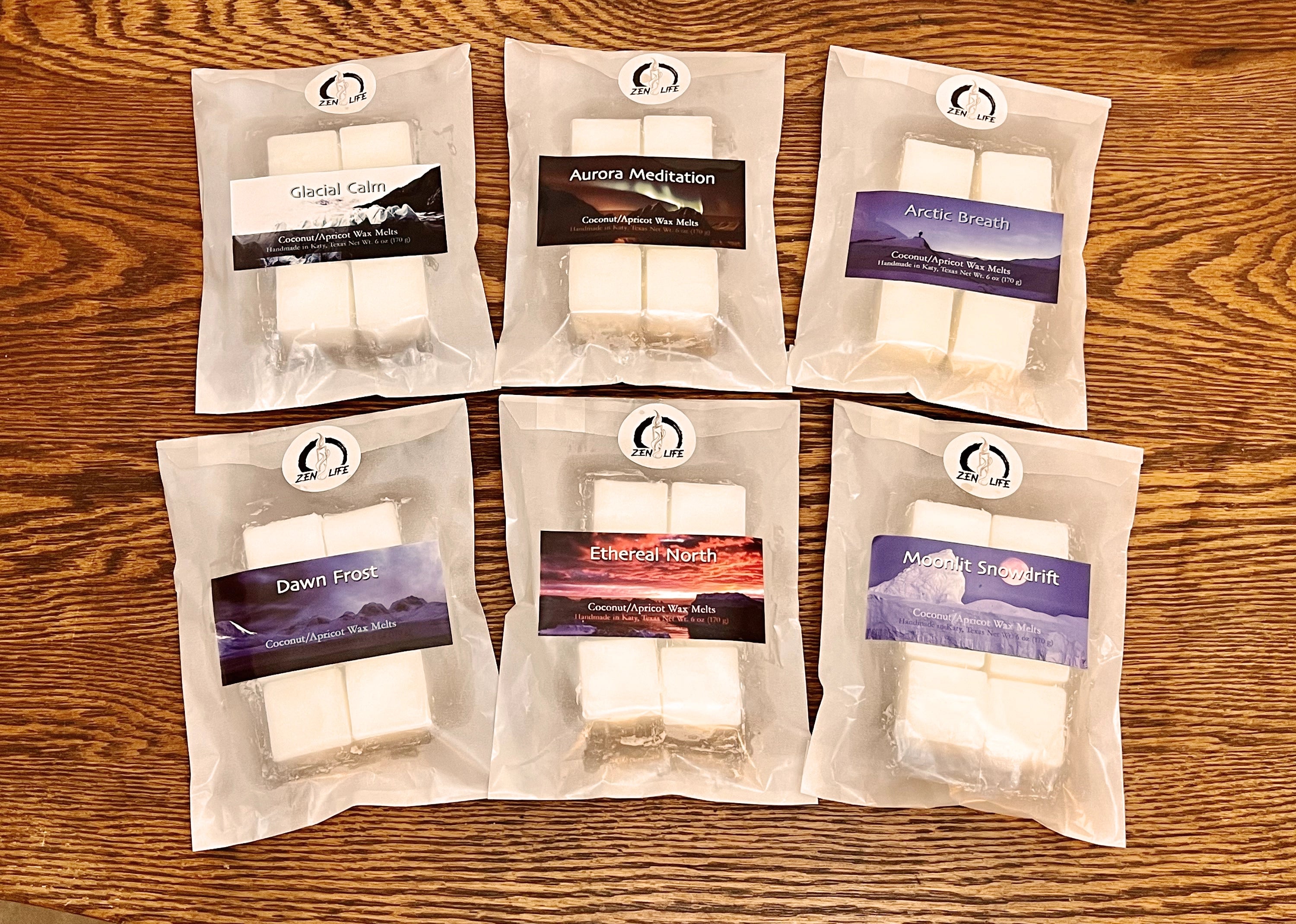 Six bags of wax melts for the Arctic Circle Collection on a wooden surface. Each bag contains six 1 oz melts.