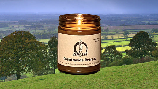 Zen Life's Countryside Retreat candle over a countryside landscape.
