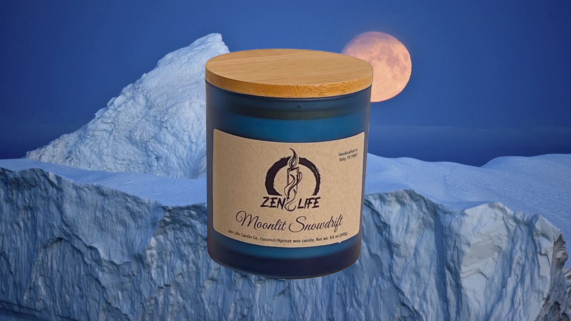 Zen Life's Moonlit Snowdrift candle against a snowy landscape under a moon.